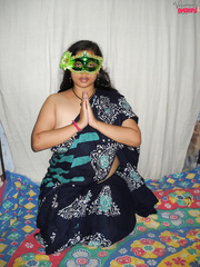 Cumbrous Indian woman Wet covers up her exposed billibongs after getting undressed in a mask