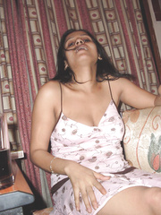 Indian female bares large naturals and gazoo during the time that smokin' a cigarette