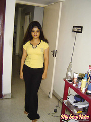 Indian hotty Heha puts a smile on her  face during non in nature's garb positions