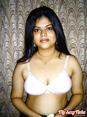 Obese Indian beauty Neha Nair lets her meatballs spill forth from white brassiere