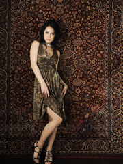 Japanese gal Maria Ozawa models non in nature's garb in a suit and jewelry