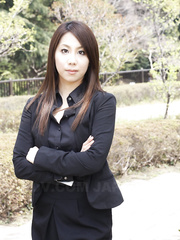 Japanese model Hikaru Matsu takes her glasses on and off in business raiment