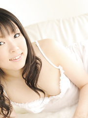 Alluring Japanese cutie Aoi Minami discloses her cute miniature scoops and bushy pussy