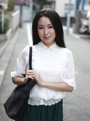 Japanese schoolgirl Anna Sakura pauses in the street to flaunt her sexy girl