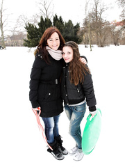 Youthful lesbos take up with the tongue and finger pussies after a day of sledding in the snow