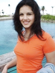 Indian solo cutie Sunny Leone bares her scones previous to sliding shorts over her arse