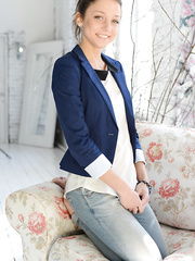 Barefoot youthful angel Nensi B stripping off jeans and underclothes