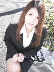 Hawt redhead Japanese gal in dress positions to show her glamorous face