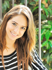 Enchanting legal age teenager in jeans flashing large teats outdoors & widening gazoo in stripped feet