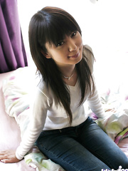 Skinny oriental chick with neat butt stripping off all of her clothing