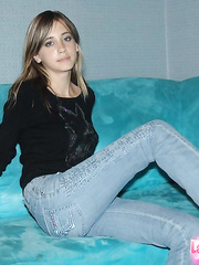 Cute non-professional blond in taut jeans strikes seductive positions to show off her butt
