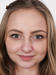 Youthful blond Irena peels off her jeans and stands stark nude for the camera