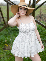 Country angel lifts her costume for bare upskirt showing hairless pussy and butt