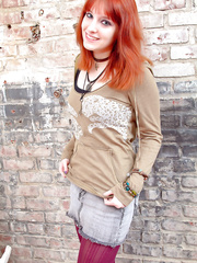 Dilettante hottie with red hair uncovers her large naturals in purple leotards