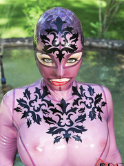 Latex addicted chick Latex Lucy positions at the backyard in insane uniform