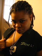 A very sexy black girl posing she has a great booty and knows it