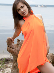 Enchanting legal age teenager cutie Trista A takes off her costume to pose in nature's garb down by the ocean