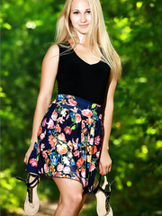 Blond erotic hotty disrobes in the forest to widen hot legs on the ground