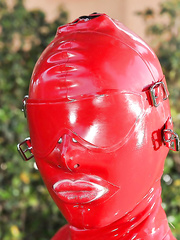 Voluptuous fetish vixen in latex dress revealing her soaked slit outdoor