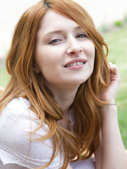 Lovely ginger babe with a cute ass Daria shows off her moist love tunnel