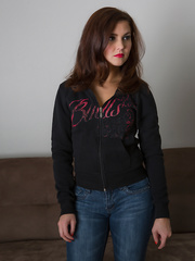 Smiling girl Stephy Parker pulls down her jeans to show her pleasant round wazoo