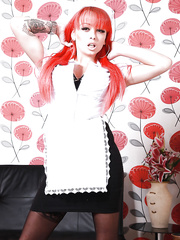Redheaded nurse Billie Rai flashing upskirt leg and garters
