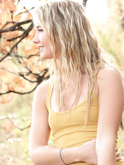 Slim non-professional golden-haired Jewel sheds her garments to squat in nature's garb beneath a tree