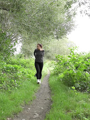 Cute brunette hair angel Teresa Way-Out squats to take a pee on path in the woods