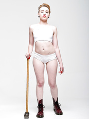 Blond bombshell Miley Mae in white pants showing hot pierced tongue