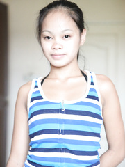 Juvenile Oriental cutie bares her tiny mangos as that babe disrobes for a sex tourist