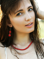 Legal Age Teenager cutie with marvelous face heads into the woods to catch rays on her naked body