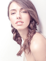 Fair skinned solo hotty Nadine B removes her sweater and belt for naked positions