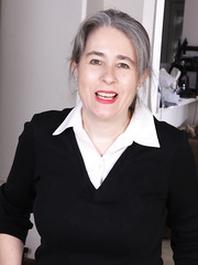 Mature lady with grey hair parts her moist beaver after removing raiment and pantyhose