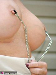 Aged lady Adonna loves torturing her pierced slit and hot teats outdoors