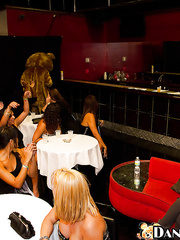 Dressed hotties are doing blowjobs to a dancing stripper bear