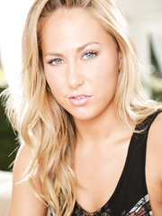 Sexy golden-haired Carter Cruise positions on her knees in boots showing her ideal a-hole