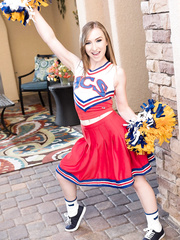 Miniature cheerleader Gracie Green disrobes her uniform and positions being slutty
