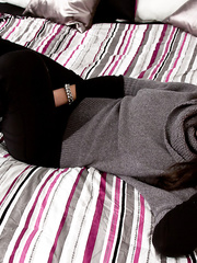 Dark Brown erotic model Kendra Rain teasing with large milk shakes wearing belt pants