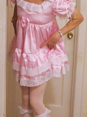 Shirley's sissy photos lifting up frilly dress to reveal chastity cock