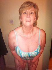 Mature karen sexy milf swimsuit stripping revealing breasts for you