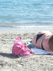 Sexy wife 32 years old milf sunbathing on a public beach