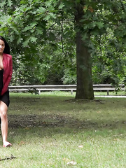 Black haired older Lexi lifting her lengthy petticoat and pissing in the park