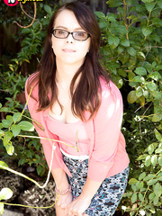 eighteen year old nerd Jennifer Matthews undresses stripped on garden pathway