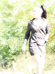 Cute youthful Esperansa hikes up her short costume to take a sexy pee on the path