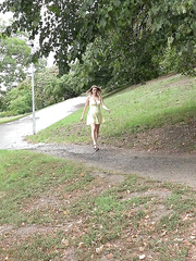 Golden-Haired beauty hikes up her costume to take a badly needed curbside pee