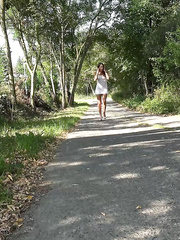 Solo beauty Yenna hikes her costume,strapon pulls down her thing and piddles in woods