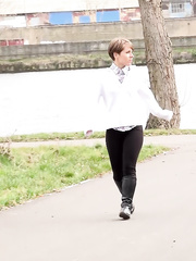 Short haired Shila in tall boots shows her bald love tunnel whilst peeing in public