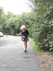 Hawt golden-haired Chrissy squats by the road to drop her pants & pee in the grass