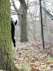 Cumbrous sweetheart Dora Dark squats behind a tree to take a void urine