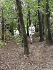 Solo gal Barbe pulls down her panties to pee in the forest